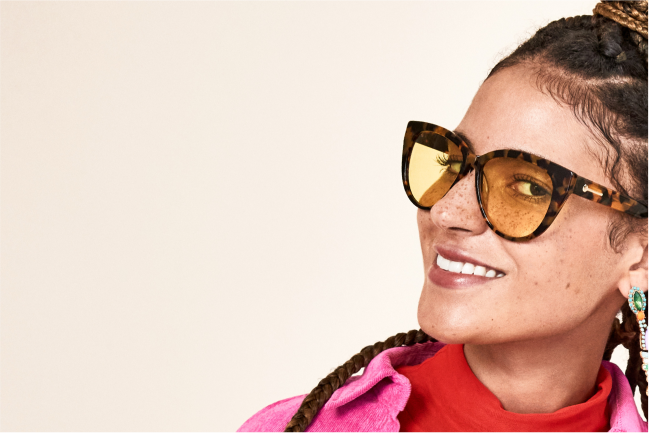 Image of 2 pairs of Zenni sunglasses on a beige background with animal prints.