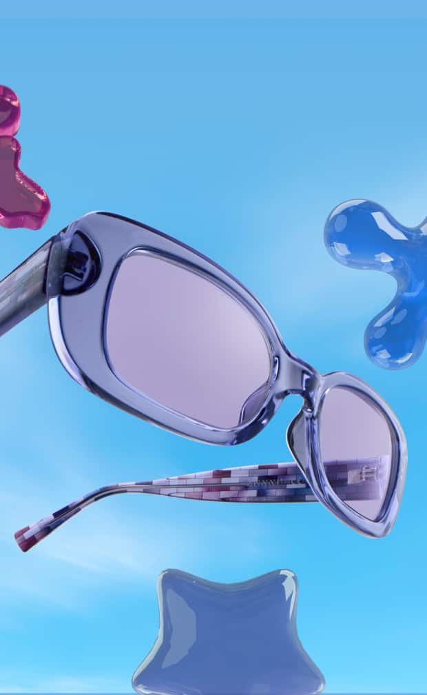 Translucent blue-purple rectangular sunglasses with purple tinted lenses and patterned temple arms floating against a bright blue sky with colorful glossy jelly splatters.