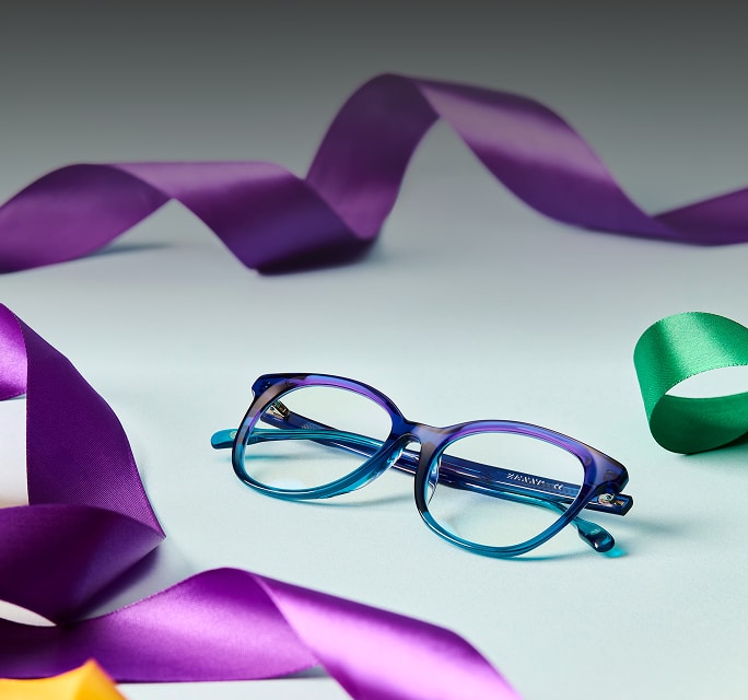 Blue and purple rectangle Zenni glasses on a gray background with colorful ribbons.