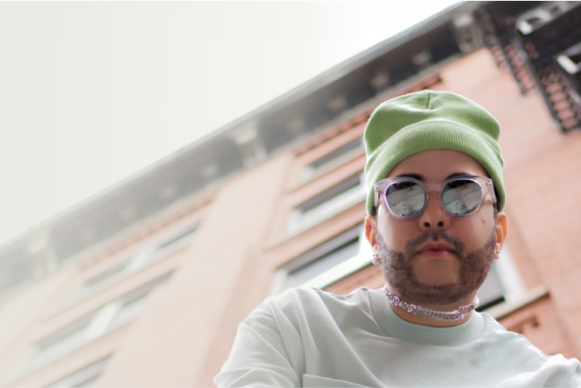 A man with green beanie and light gray sweater, wearing Zenni translucent frame with mirror tint sunglasses.