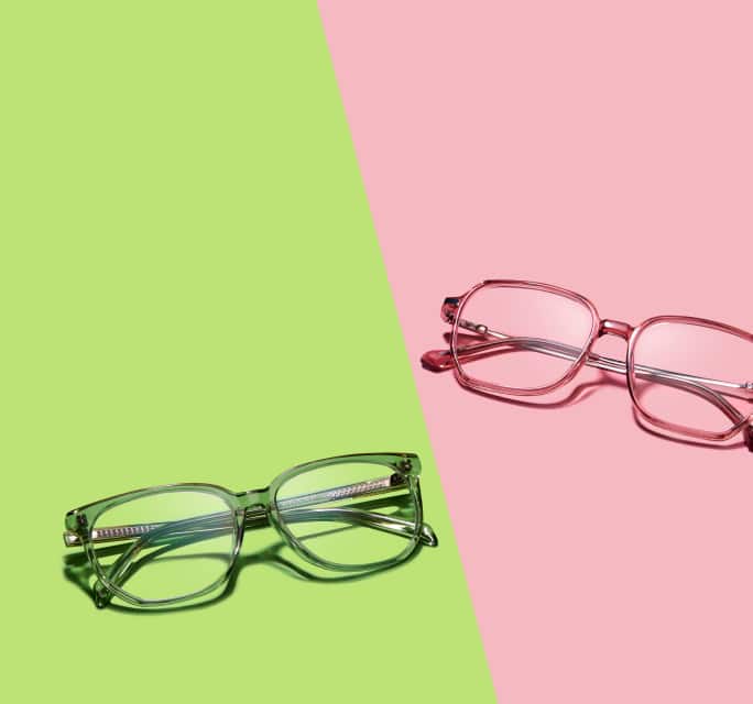 Two pairs of Zenni glasses—one with green frames and one with pink frames displayed on a diagonal green and pink background.