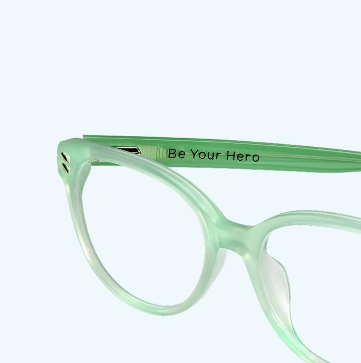 Mint green Zenni glasses engraved with 'Be Your Hero' are part of Zenni’s Vision of Wellness collection supporting mental health.