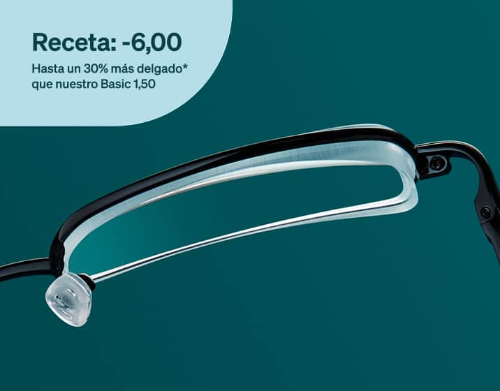 Un lente delgado de índice 1.67 en un marco de metal negro, visto desde arriba.