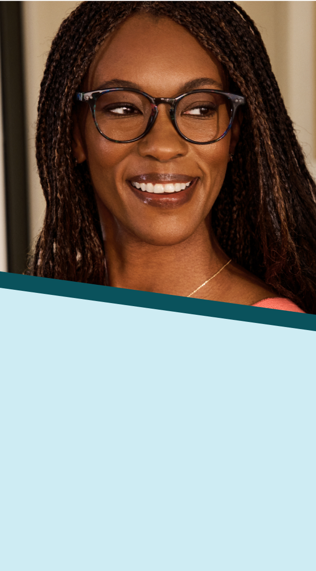 A woman with long brown and black braids wearing Zenni round tortoiseshell glasses. Background is a well-lit kitchen overlaid with a pale blue and teal pinwheel graphic.