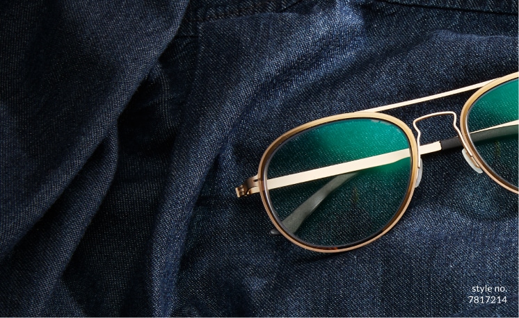 Image of Zenni aviator glasses #7817214 laying on top of denim fabric.