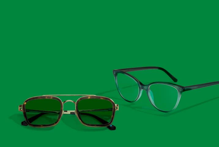 Tortoiseshell aviator sunglasses and green glitter cat-eye glasses on a green background, from the 'Lucky Looks' Boston sports-inspired collection.