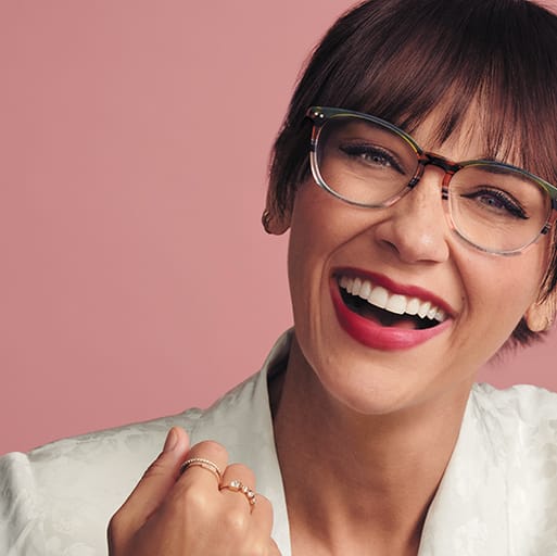 Actress Rashida Jones wears multi-colored acetate square glasses #4438529 in forest.