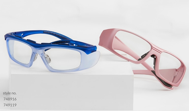 Image of Zenni Z87.1 safety glasses #748916 and #749119 positioned on a white platform.