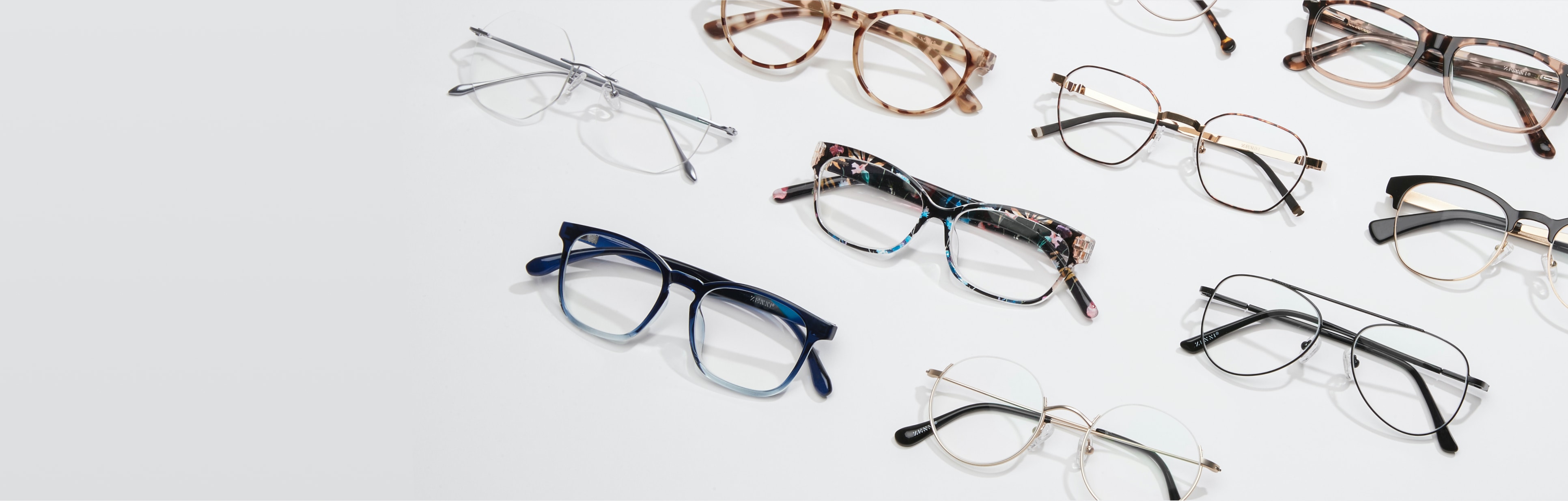 Image of a collection of Zenni glasses, against a white background.