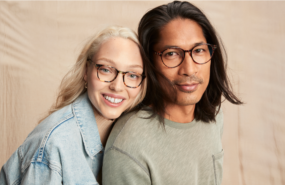 Image of a couple wearing Zenni glasses, in an embrace.