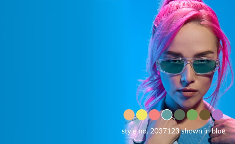 A woman with pink hair wearing plastic aviator glasses with blue lenses.