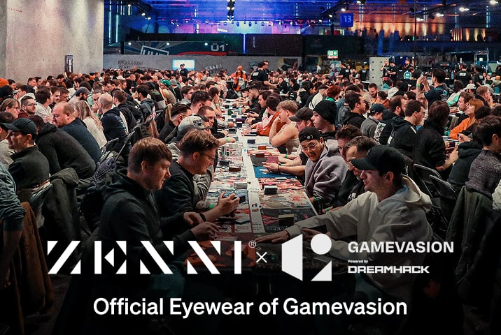 The Zenni logo and the Gamevasion by Dreamhack logo superimposed over a crowd of people playing tabletop card games in a large conference center space.