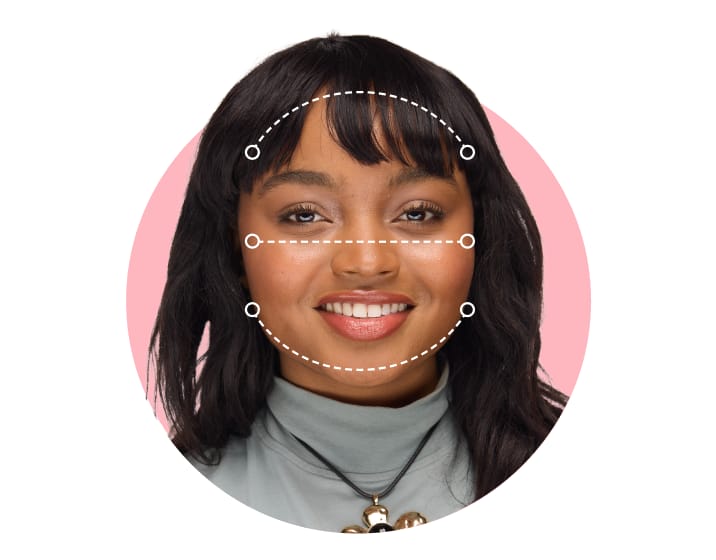 Diagram showing a white dashed outline measuring a round face shape on a model.