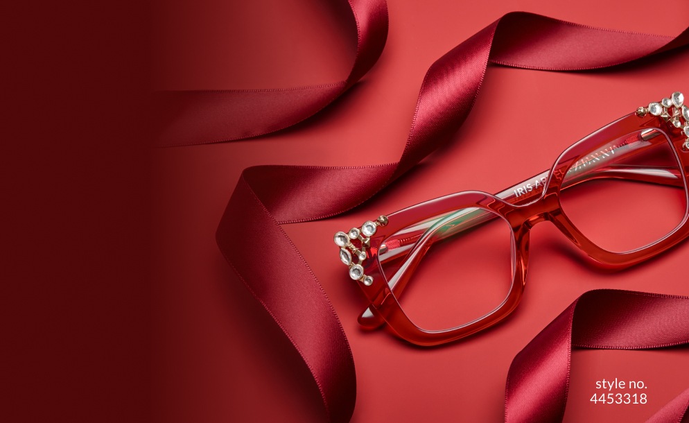Image of Iris Apfel x Zenni puttin’ on the ritz square glasses #4453318, against a red background with burgundy ribbon.