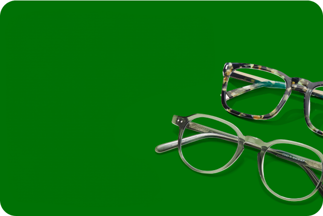 2 pairs of patterned glasses on a dark green solid background.