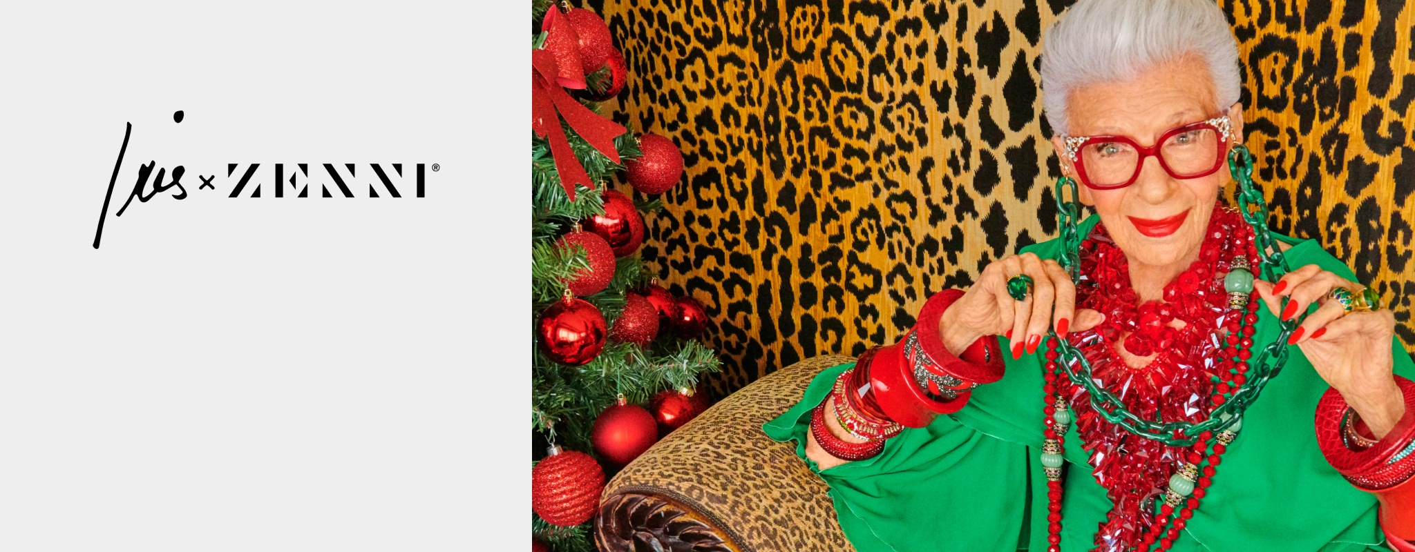 Iris Apfel wearing a brightly colored outfit, with Zenni glasses and eyewear chain in front of a leopard-print wall.