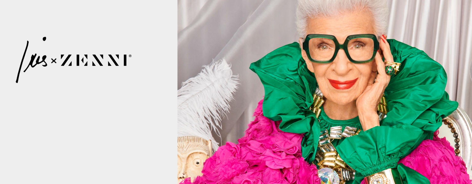Image of Iris Apfel wearing Zenni Good to be square glasses #4452924. She is wearing a bright green ruched collar and is in front of a silver wall.