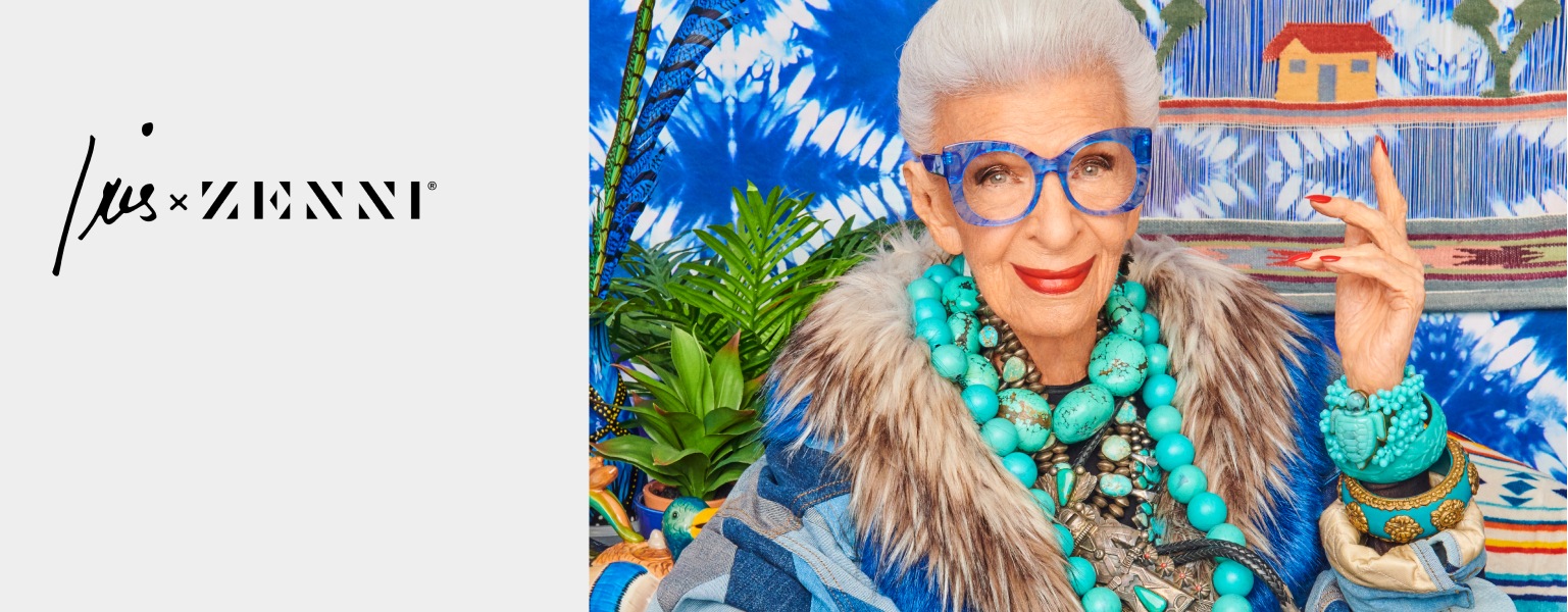 Image of Iris Apfel wearing Zenni What’s New Pussycat cat-eye glasses #4452616. She is wearing large turquoise jewelry and is standing in front of a tie dye-printed wall.