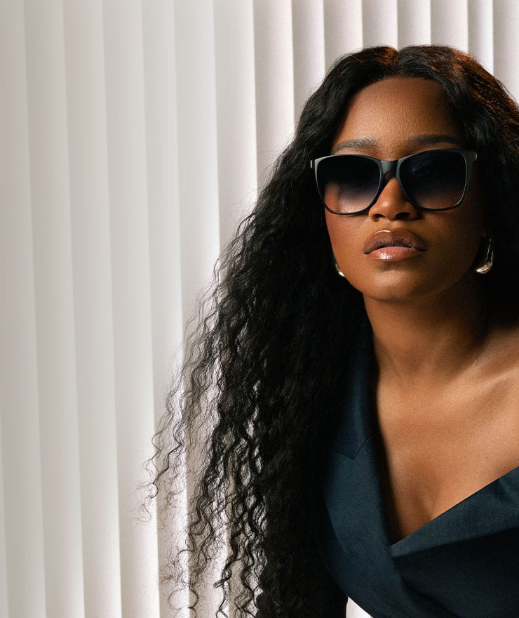 (2)Keke Palmer wearing a pair of square sunglasses from "Board Certified," the second collection in the Keke Palmer x Zenni frame collaboration.