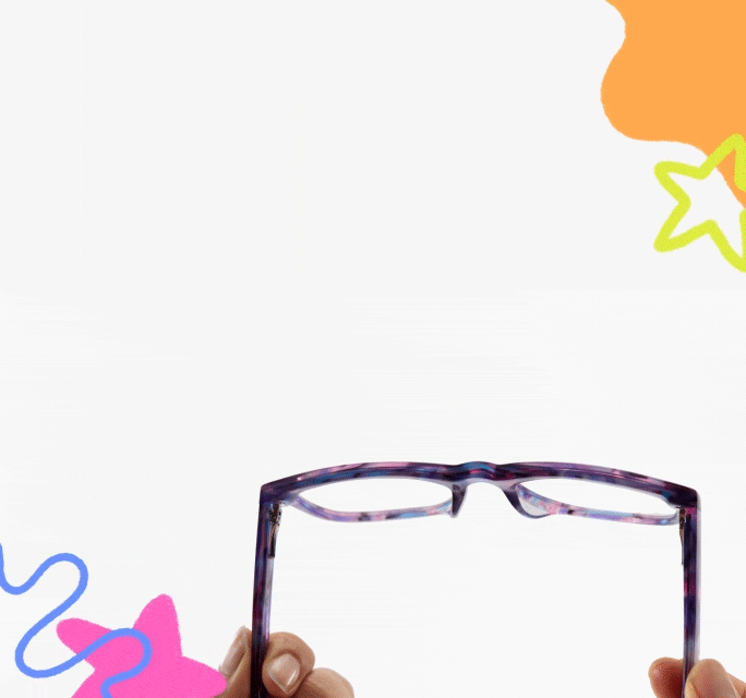 Hands holding purple tortoiseshell kids eyeglasses, demonstrating the spring hinges on a white background decorated with colorful doodles.