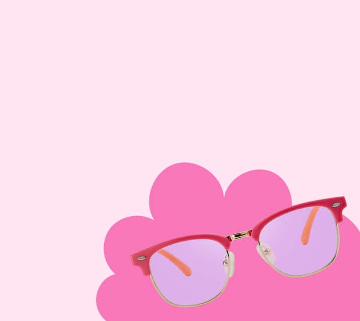 Red browline kids’ sunglasses with patterned temple arms on a pink background featuring a cloud shape.
