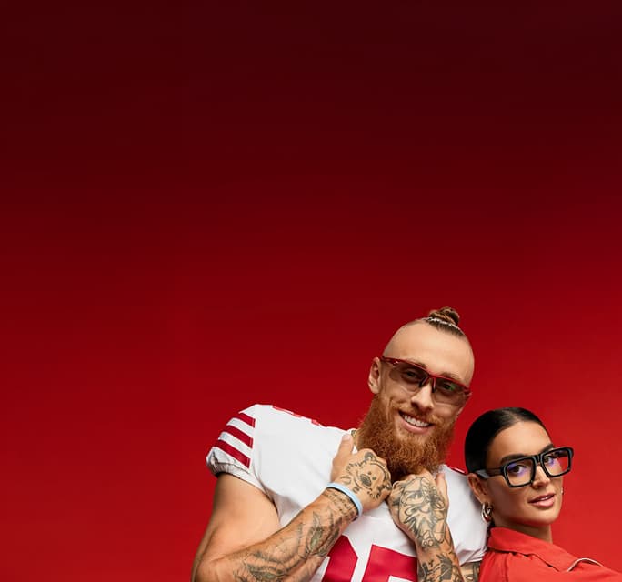 George Kittle in red framed Zenni sunglasses and Claire Kittle in black square Zenni glasses, on a red background.