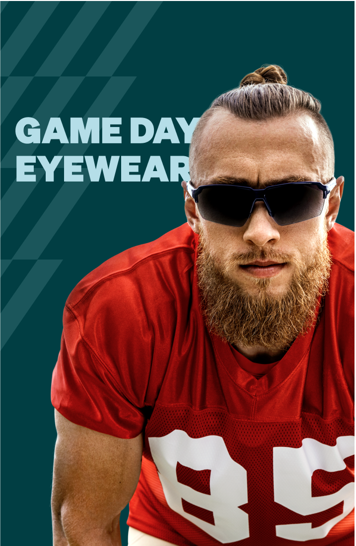 George Kittle in a pair of blue and black “Yay Area” Zenni sports performance sunglasses has his long hair slicked back in a bun wearing a red San Francisco 49ers football jersey against a dark teal geometric pattern background.