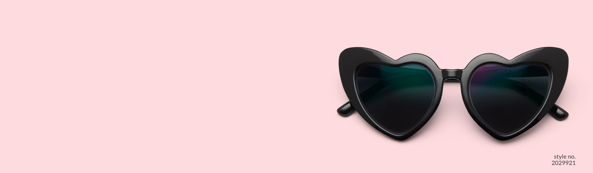 Image of Zenni black heart-shaped glasses #2029921 with dark gray tint.