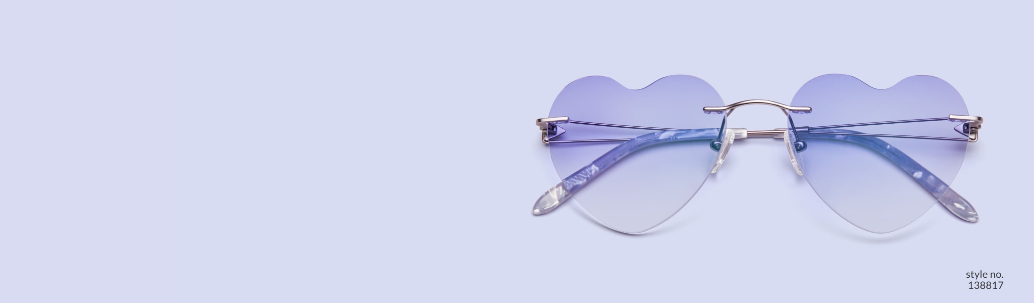 Image of rimless frame #138817 with heart-shaped lens and ultraviolet gradient tint on a purple background.