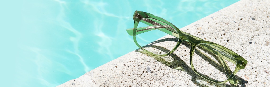 Image of Zenni rectangle glasses #125024 resting beside a pool.