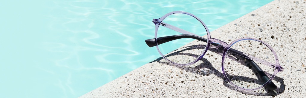 Image of zenni round glasses #126917, resting beside a pool.