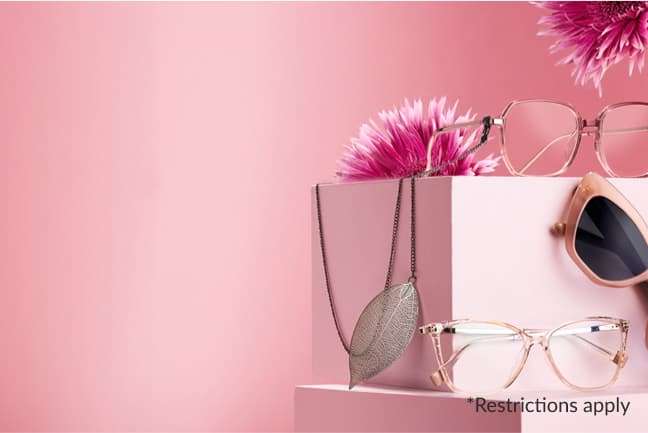 Three pairs of pink gasses and silver eyeglass chain displaying on pink blocks with flowers decorations.