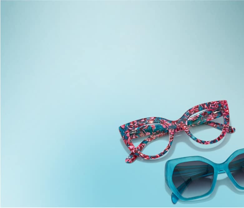 Floral cat-eye glasses and teal geometric sunglasses on a blue background.
