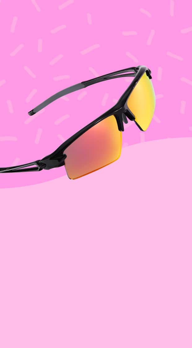 Clear round glasses on a green background.