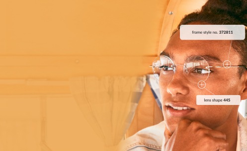Image of a man wearing Zenni rimless glasses #372811 inside of a vintage bus.