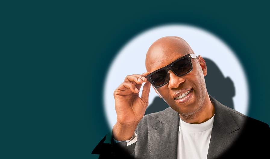 Sam Cassell in Zenni sunglasses, exuding confidence and a smile against a white background.