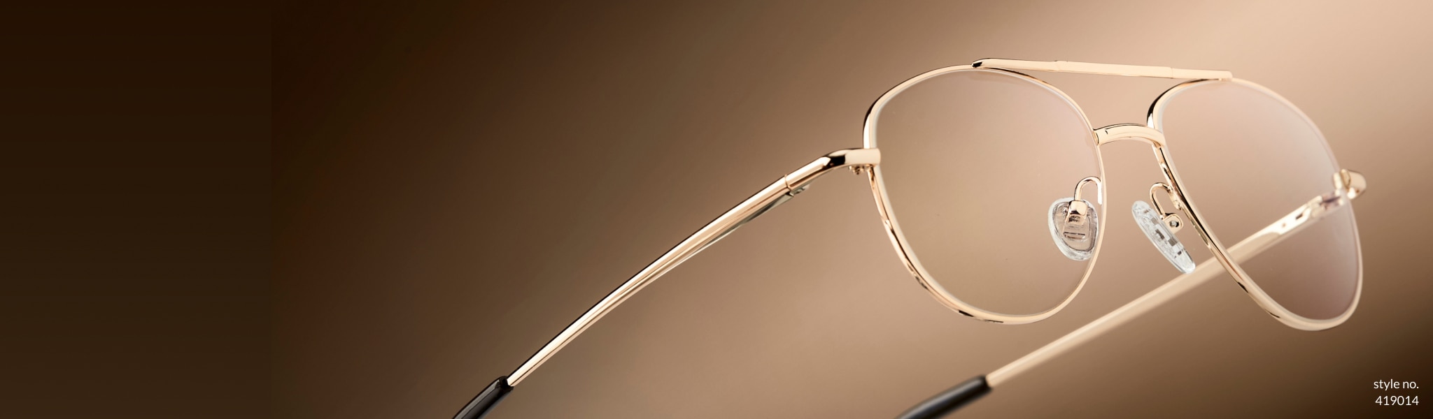 Winning metals. Reach the top of your style game in gold, silver, and bronze eyewear. Shop all metals. Image of Zenni aviator glasses #419014 against a gold background.