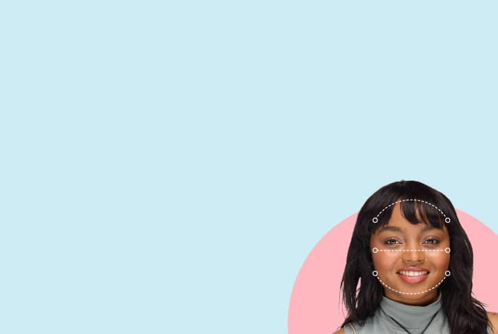 Smiling woman with curly hair and bangs with dashed lines tracing a round face shape, set against a pink circular background.