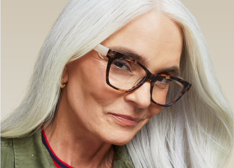 Woman with long silver hair wearing Zenni tortoiseshell glasses.