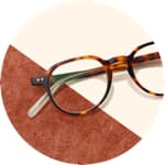 Zenni Escape round glasses #4430925 on a cream-colored background with brown accents.