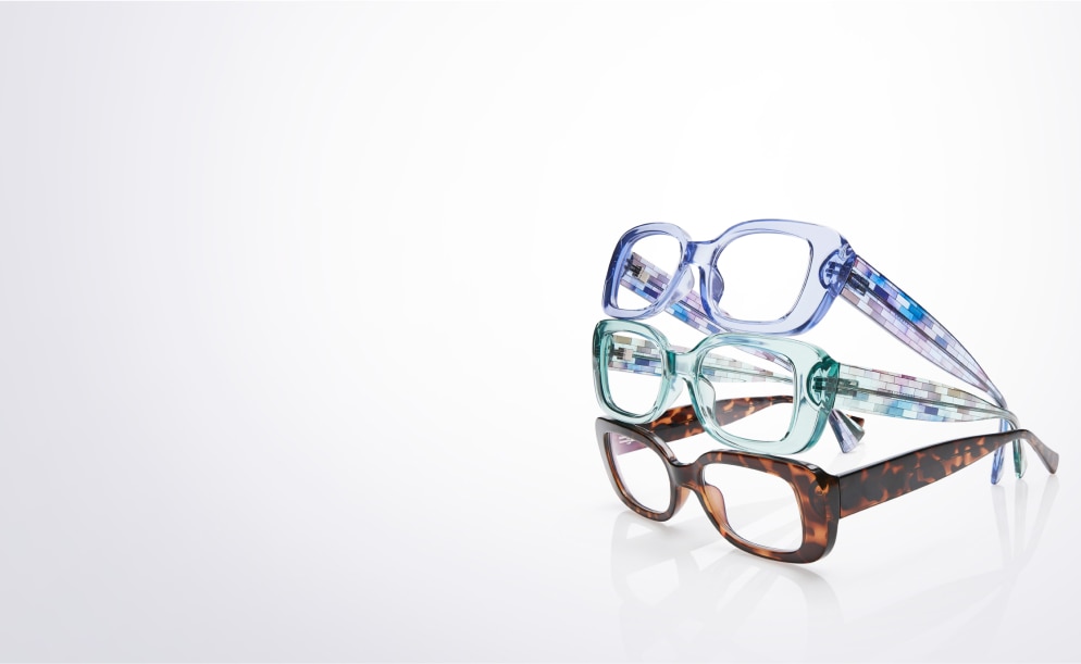 A stack of three rectangle glasses from bottom to top: tortoiseshell, clear green, clear blue.
