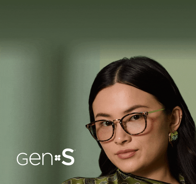 Close-up of a woman wearing dark-tinted tortoiseshell eyeglasses with bright green temples beside white 'Gen S' text against a sage green background.