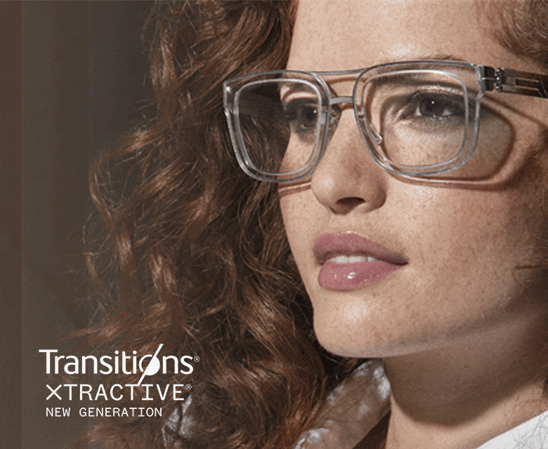 A woman wearing clear rectangle frames with Transitions lenses that go from clear to dark.