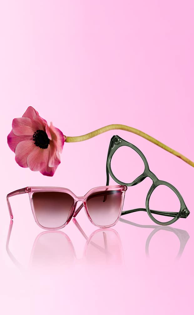 Zenni pink sunglasses and green eyeglasses with a flower on a pink background.