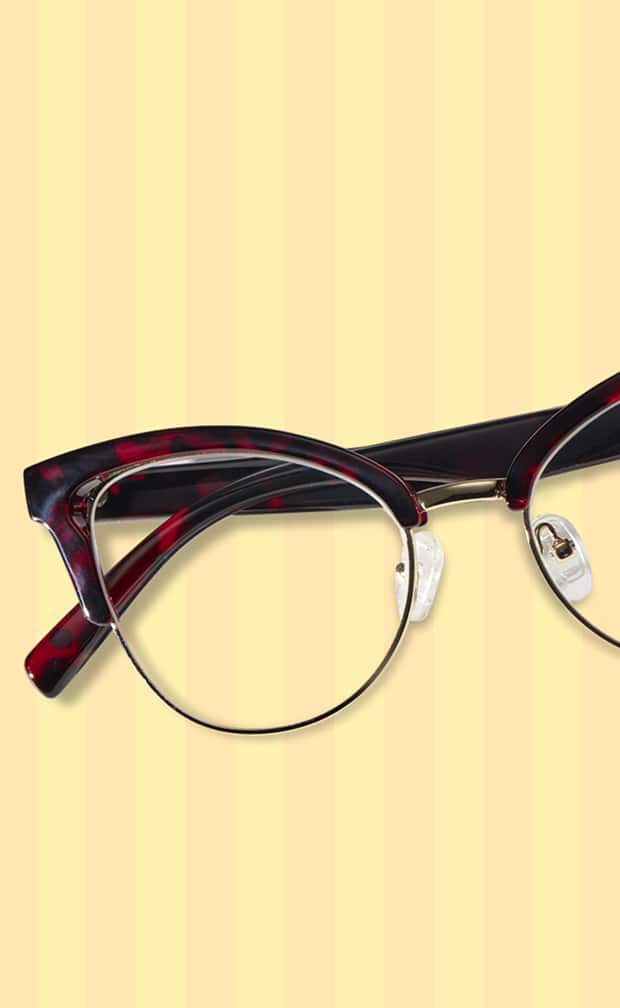 Zenni tortoiseshell browline glasses on yellow striped background.