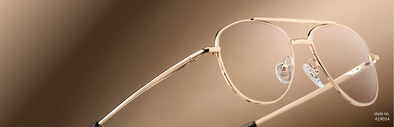 Winning metals. Reach the top of your style game in gold, silver, and bronze eyewear. Shop all metals. Image of Zenni aviator glasses #419014 against a gold background.