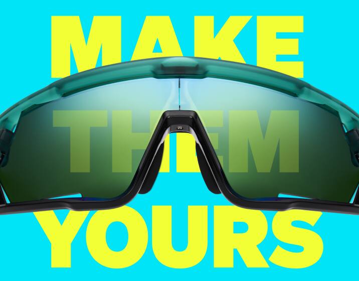 Close-up of Zunnies Sports Sunglasses with tinted lenses against a blue background with yellow text “Make Them Yours.”