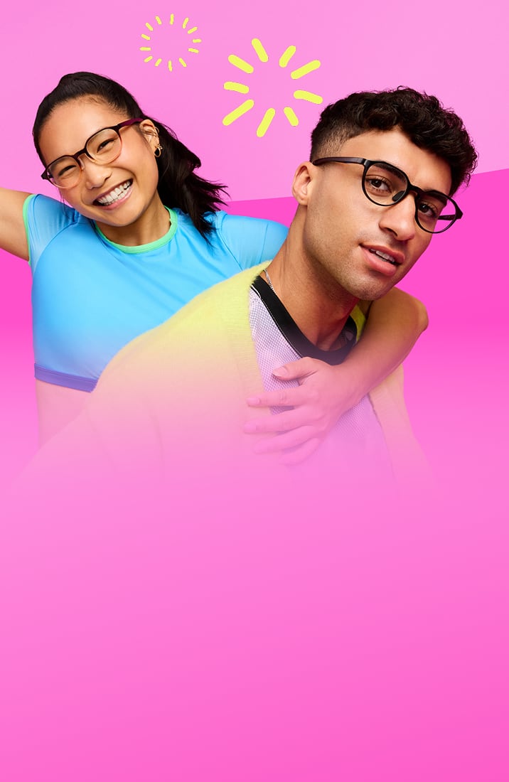 Two models in activewear wearing eyeglasses, smiling against a pink gradient background.