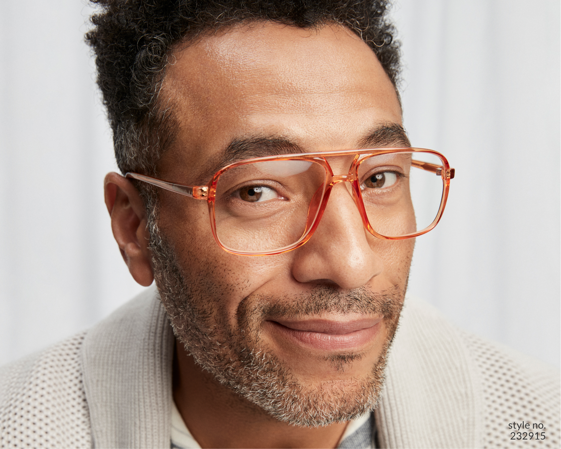 Image of a man smirking wearing Zenni aviator glasses #232915, in front of a white background.