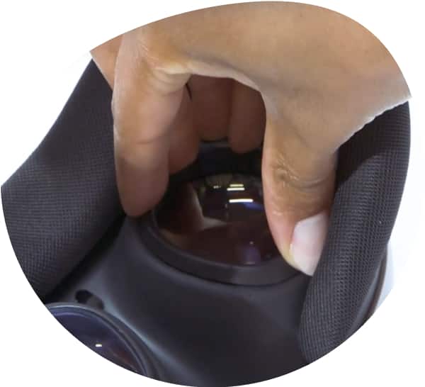 A hand is placing the right (R) lens insert on top of the right lens of a Meta Quest 3 VR headset.